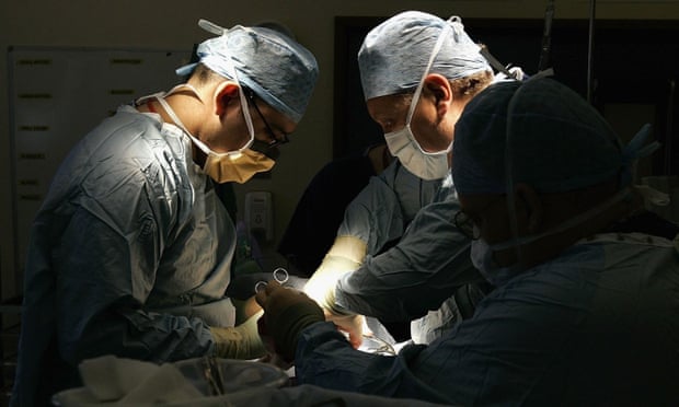 Birmingham hospital surgeons conduct a kidney transplant