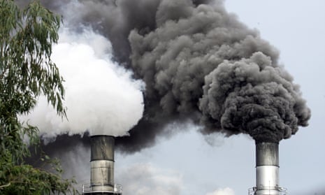 Black smoke is emitted by a sugar mill in Manila, Philippines