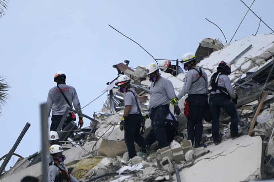 Rescue workers look through the rubble of Champlain Towers South in the Surfside area of Miami.