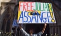 A protester holds a placard in support of Julian Assange outside the high court in London