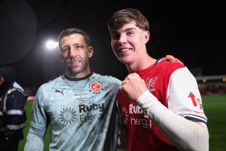 Jay Lynch and Conor Haughey of Fleetwood Town smile together, one fist-pumping, after their Carabao Cup win