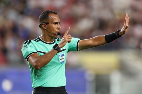 Referee Dahane Beida gestures
