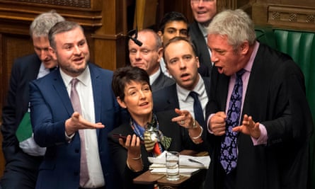 Bercow surrounded by MPs during the weekly PMQs in the House of Commons.