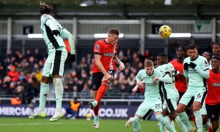Luton’s Ross Barkley scores a header against Chelsea