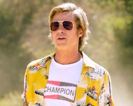 man in patterned shirt and sunglasses looks ahead