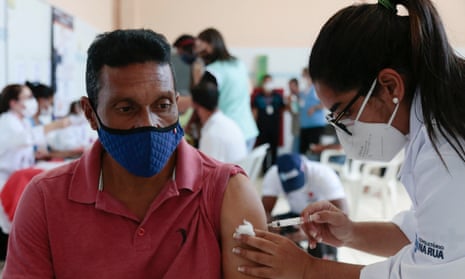 A homeless man receives a Covid-19 vaccination in Sao Paulo, Brazil. 