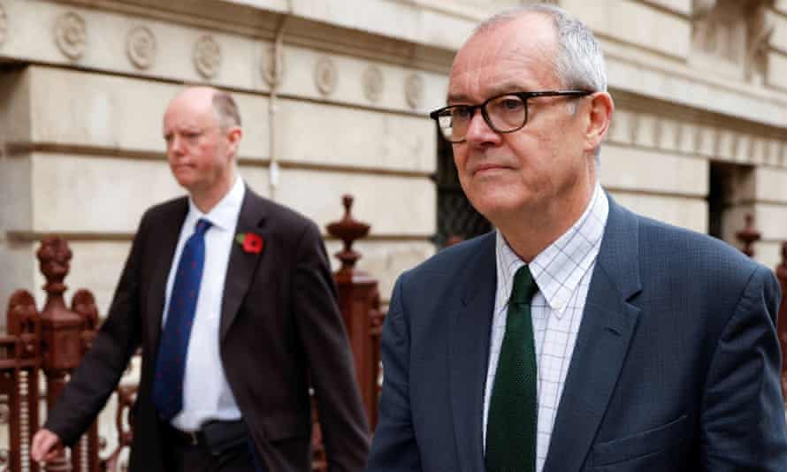 Chris Whitty and Sir Patrick Vallance leave the Foreign Office in London in November.