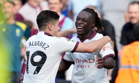 Julián Álvarez congratulates Jérémy Doku after the Belgian scores his first goal for Manchester City.