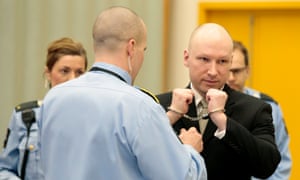 Anders Behring Breivik has his handcuffs removed inside the courtroom at Skien prison