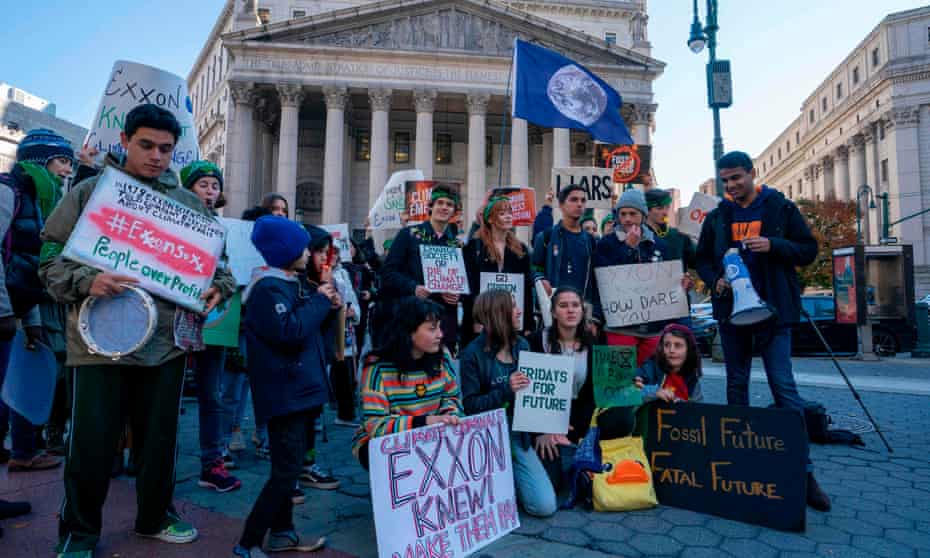 Climate protesters outside the New York county courthouse, where the trial took place. Exxon hailed the ruling in a trial it said stemmed from a ‘baseless investigation’.