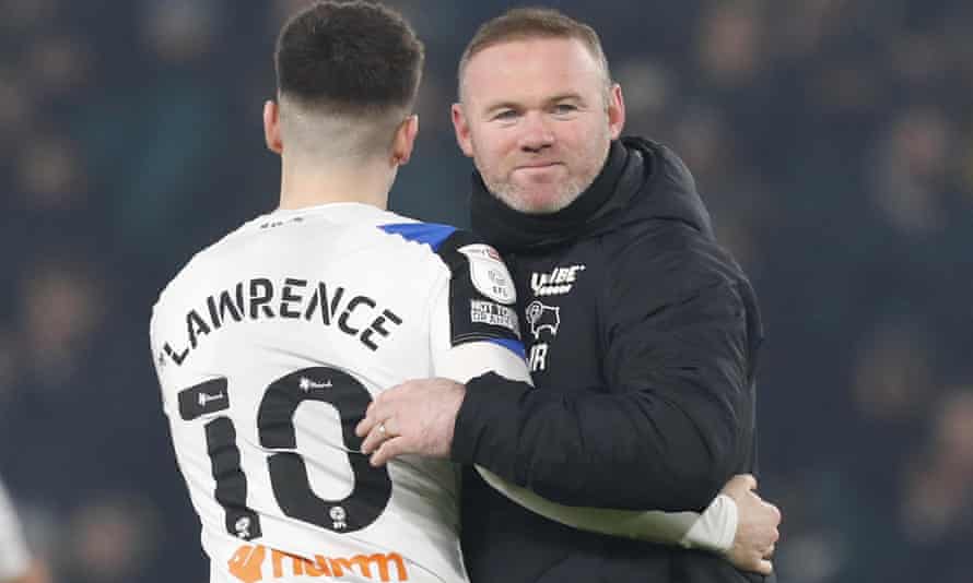 Wayne Rooney with Derby's Tom Lawrence