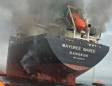 The Thai‑flagged cargo ship Mayuree Naree on fire after being hit by Iranian missiles in the strait of Hormuz in March 2026.