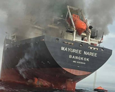 Smoke pours from a large tanker.