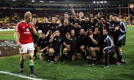 Lewis Moody walks past the jubilant New Zealand players after the All Blacks secured the series at Wellington.