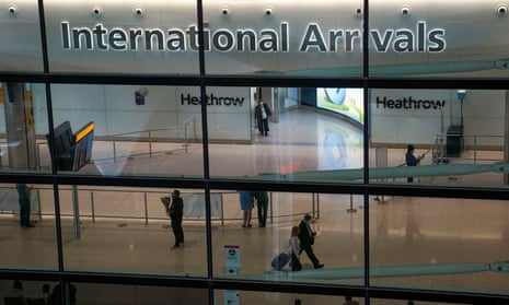 Passengers in the international arrivals hall at Terminal 2 of London Heathrow