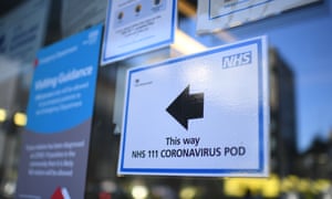 BRITAIN-HEALTH-VIRUS-HOSPITAL<br>A sign points the way to a NHS 111 Coronavirus Pod at The Royal London Hospital in London on March 23, 2020. - Prime Minister Boris Johnson warned on Sunday he may impose tougher controls on the British public as packed parks, markets and cafes at the weekend showed thousands of people defying government warnings about social distancing. The PM gave notice of potential tougher action as the latest health department figures revealed that 281 people had now died from COVID-19 in the UK, an increase of almost 50 fatalities in the past 24 hours, and there are 5,683 confirmed cases. (Photo by DANIEL LEAL-OLIVAS / AFP) (Photo by DANIEL LEAL-OLIVAS/AFP via Getty Images)
