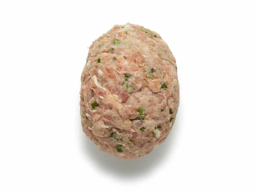 Felicity Cloake’s scotch eggs 6. Wrap the egg in the casing