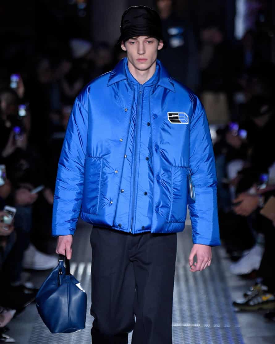 Blue quilted jacket and bag at Prada.