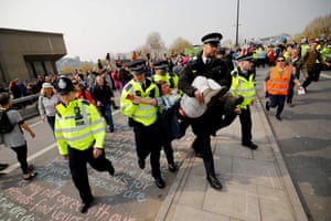 Police arrest a climate change activist on Waterloo Bridge