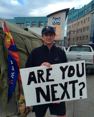 Fletch, a worker at a Carlton United Breweries depot in Victoria, Australia is protesting against new conditions with a sign reading, “Are you next?”