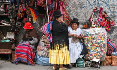 Old women with traditional hats at market stall