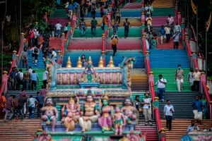 People gather at the Batu Caves in Malaysia to perform a morning prayer ceremony