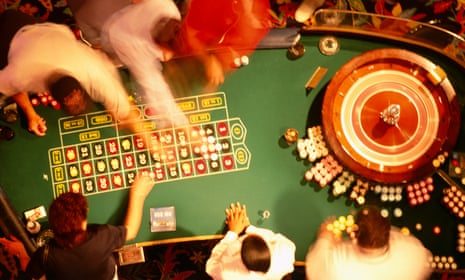 High angle view of a group of people at a roulette table