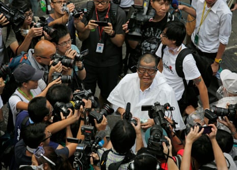 Media mogul Jimmy Lai wearing goggles appears outside government headquarters to join a protest in Hong Kong, Sept. 28, 2014.