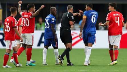 Levi Colwill (right) speaks with the referee, Slavko Vincic, during the Club World Cup last-16 match against Benfica