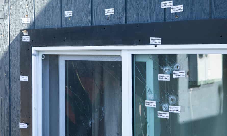 Tags mark bullet holes at the house where four people were shot dead in Inglewood.