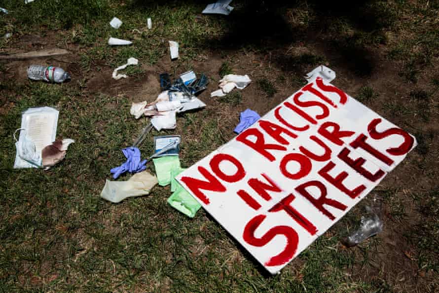 Bandages and protest signs are left on the lawn of the California State Capitol after protests in 2016.