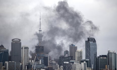 Smoke billows across the central business district skyline on Tuesday in Auckland, New Zealand. 