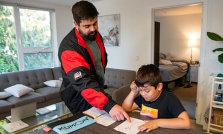 Man helping his son with his homework