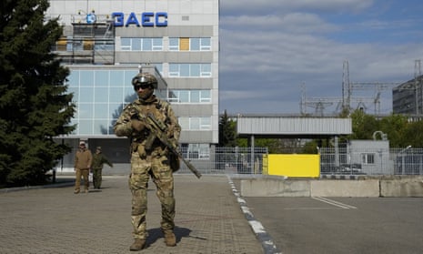 A Russian soldier stands guard at the Zaporizhzhia nuclear power station in Ukraine