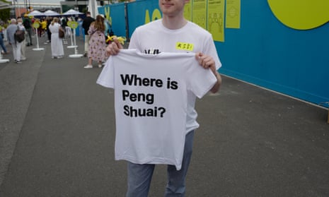 Melbourne based activists hand out "Where is Peng Shuai?" t-shirts outside Rod Laver Arena before the Women's final during day 13 of the 2022 Australian Open at Melbourne Park on January 29, 2022