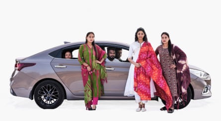 Achal, university student Kajal, agriculturalist Srikanth, restaurant owner Santosh, university student Pushpa, and housewife Karisma, with their Hyundai in Nandi, Karnataka, India