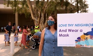 Sun Valley resident Aurora Perez reminds parishioners of Grace Community Church to wear a mask.