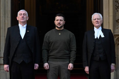 Zelenskiy posing with Speaker of the House of Lords, Lord McFall (R) and Speaker of the House of Commons Sir Lindsay Hoyle (L) prior to address British MPs in Westminster Hall.