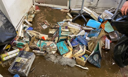 Ruined books on a muddy floor