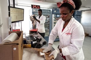 Pharmacist Nathan Kagabo and nurse Marie Claire Akingabire prepare a package of platelets at the Muhanga drone centre.