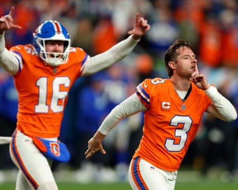 Wil Lutz and Jeremy Crawshaw of the Broncos celebrate after a game-winning field goal