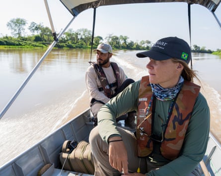 Abbie Martin and Sigano wearing lifejackets and sitting on a boat