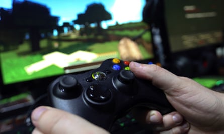 A gamer plays Minecraft on an Xbox One.