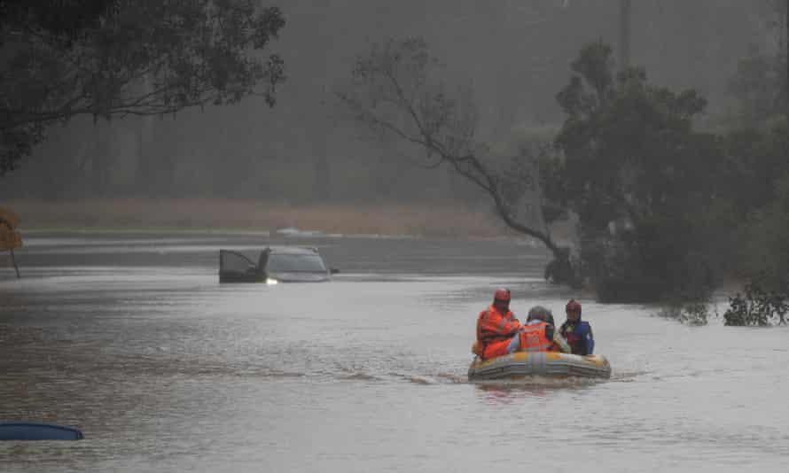 Brian Russell in the front of the boat is rescued SES from his flooded vehicle along blacktown Road near Richmond west of Sydney. Monday 4th July 2022. Photograph by Mike Bowers. Guardian Australia