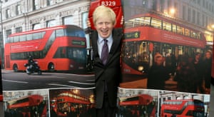 Johnson poses with artist’s impressions of the design for London’s new routemaster bus in 2010