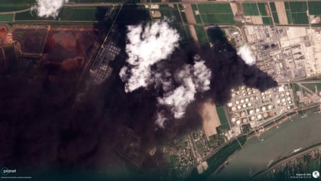 A satellite map of the facility with smoke billowing out.