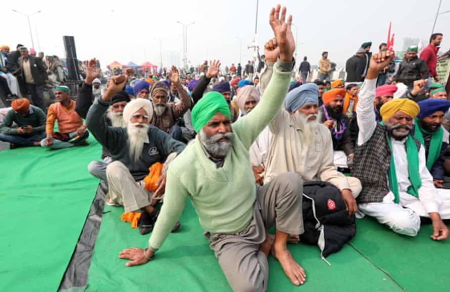 Farmers shout slogans as they take part in a sit-in at the Delhi-Uttar Pradesh border last month.