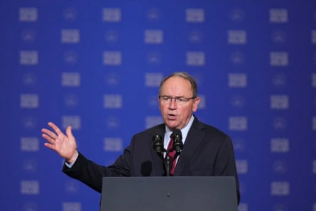 a man in front of a microphone