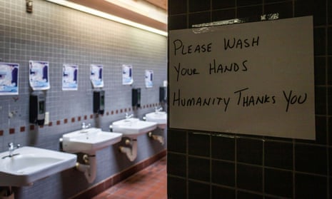 A sign reminding people to wash their hands at the bathrooms of a rest area in Richmond, Rhode Island.