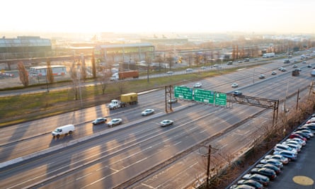 At dawn, cars drive down the US 9 highway past Newark Liberty International Airport, Newark, New Jersey, US.
